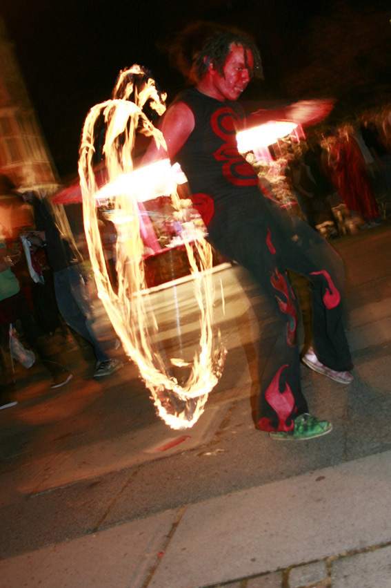 fire performer entertaining on halloween